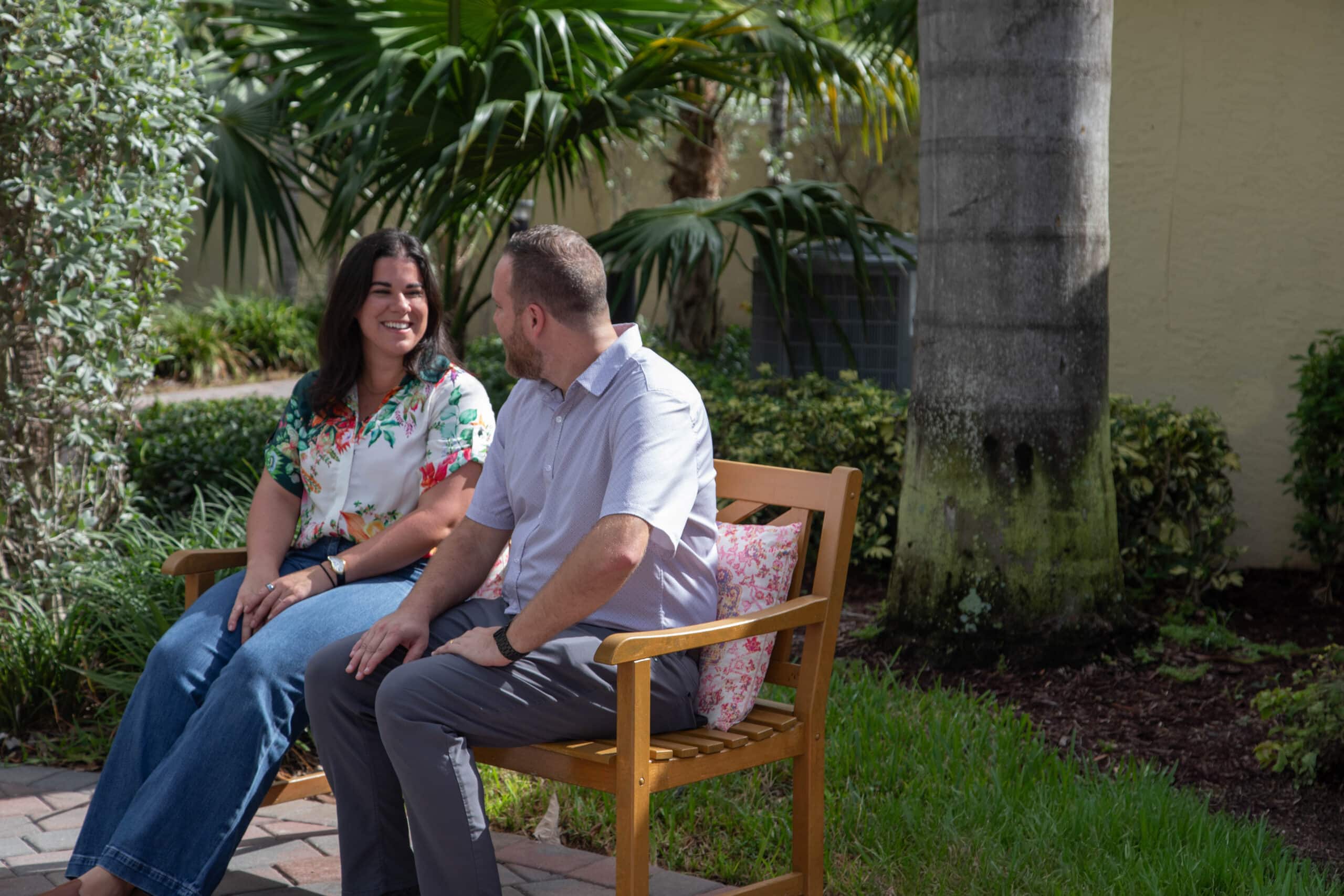 Lifeskills patient and staff member talking on campus.